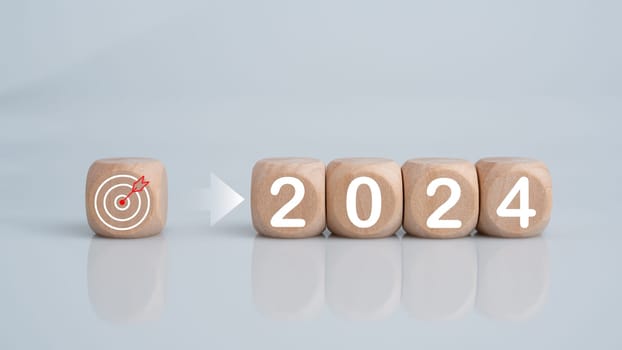 Wooden blocks lined up with the letters 2024. Represents the goal setting for 2024, the concept of a start. financial planning development strategy business goal setting