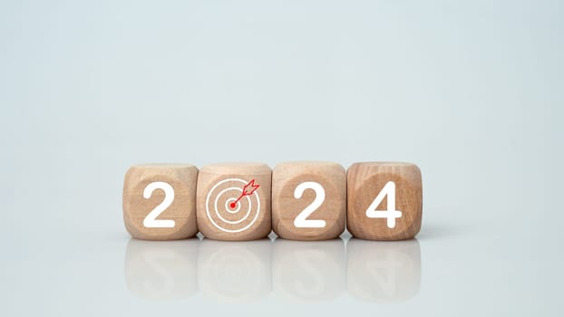 Wooden blocks lined up with the letters 2024. Represents the goal setting for 2024, the concept of a start. financial planning development strategy business goal setting