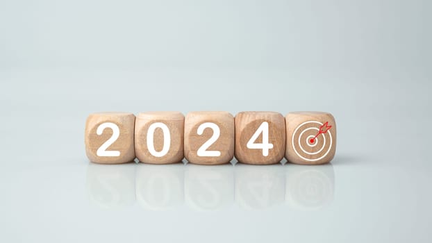 Wooden blocks lined up with the letters 2024. Represents the goal setting for 2024, the concept of a start. financial planning development strategy business goal setting