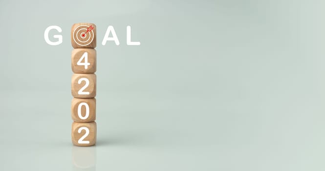 Wooden blocks lined up with the letters 2024. Represents the goal setting for 2024, the concept of a start. financial planning development strategy business goal setting