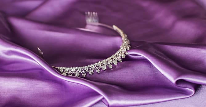 Close-up of silver diadem on purple background