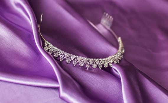 Close-up of silver diadem on purple background