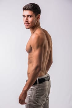 A shirtless man posing for a picture