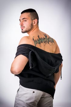A man with a tattoo on his back