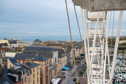 DIEPPE, FRANCE - OCTOBER 22, 2022: Top view from the ferris wheel to the city of Dieppe and the Atlantic ocean