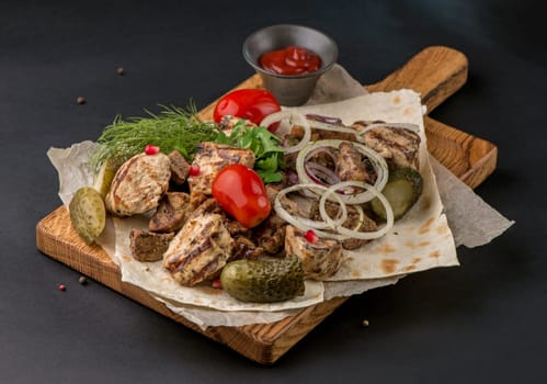 Assorted delicious grilled meat with vegetable. Mixed grilled meat with vegetables.