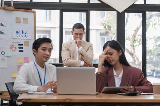 Group of business people working together and solving the problem of working stress in the meeting room at the office..