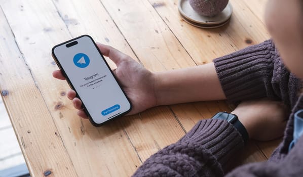 CHIANG MAI, THAILAND JUL 7 2023 : Telegram application icon on Apple iPhone 14 screen close-up. Telegram app icon. Telegram is an online social media network. Social media app.