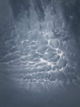 Mammatocumulus or Mammatus clouds formations. Abstract background of wonderful storm cloudscape. Dreamlike sky texture, celestial magic