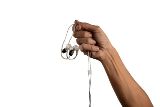 black male hand holding in ear headphone buds