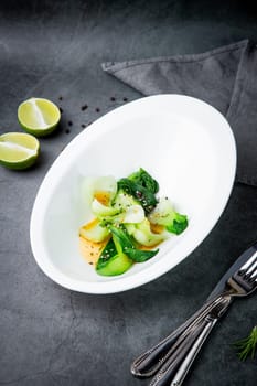 bok choy cabbage with sesame seeds and sauce in a white plate