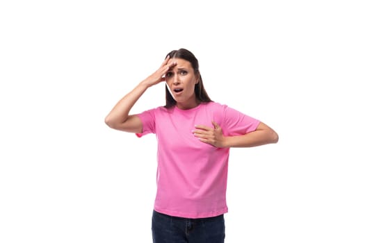 young slim woman dressed in pink t-shirt with print space.