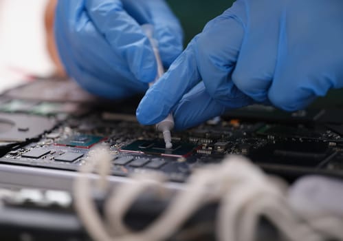 Cpu microchip processor with thermal paste. Motherboard device or electric cpu to repair cpu using thermal paste concept