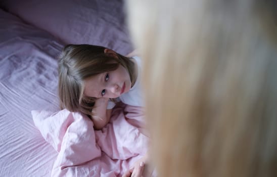 Sad little girl communicates with mother. Communication of parents with children and support in family concept