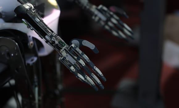Dark metal robot arm. Creation of technologies and artificial intelligence.