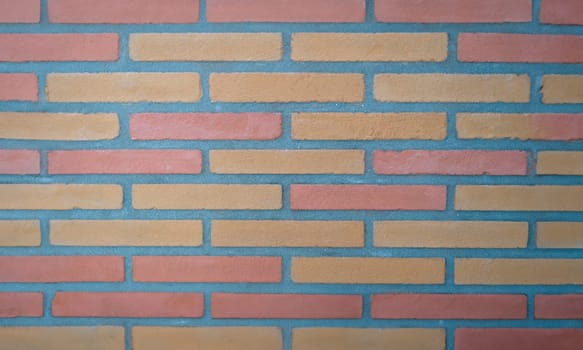 Brown tiles in form of bricks on wall background closeup. Interior design material sale concept