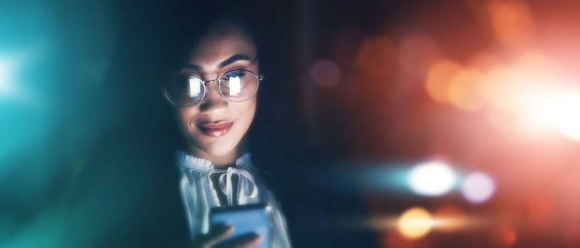 Businesswoman, phone and communication at night for texting, chatting or networking on dark background. Female employee smile holding smartphone working late for online planning strategy on mockup.