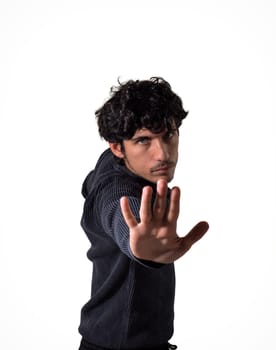 A man making a stop sign with his hands, towards the camera, in studio shot isolated on white