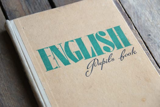 Learning English with grammar book. Foreign languages, education concept.
