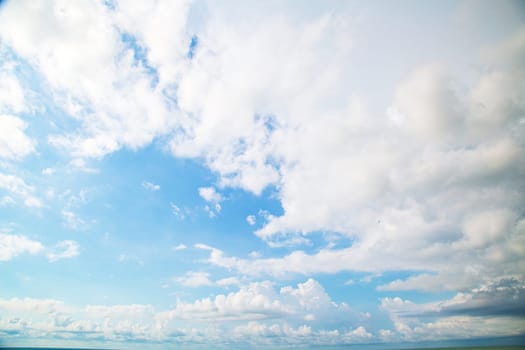 Blue sky background with clouds. Beauty clear cloudy sunshine calm bright texture. Vivid cyan landscape in spring day environment