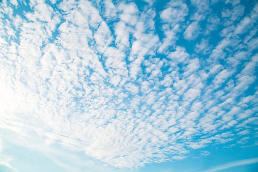 Blue sky background with clouds. Beauty clear cloudy sunshine calm bright texture. Vivid cyan landscape in spring day environment