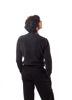 A man in a black sweater and black pants