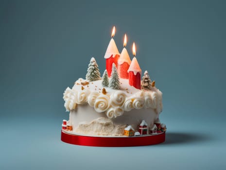 Beautiful Christmas cake decorated with candles. Christmas dessert.