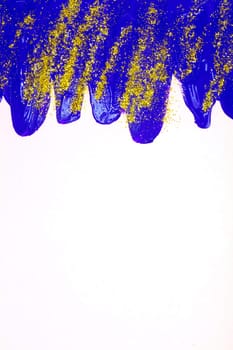On a white background, blue iridescent smudges of flowing acrylic paint with gold sparkles.