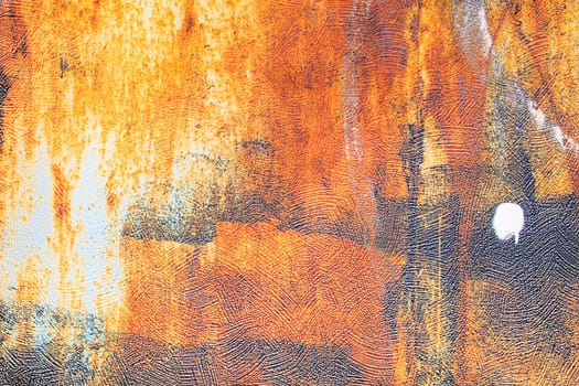 Grunge texture pattern of a rusty wall on paper wallpaper.