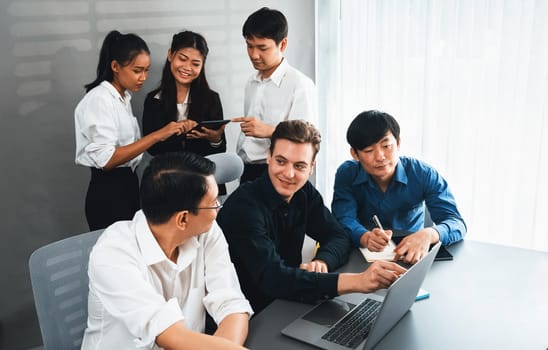 Group of diverse office worker employee working together on strategic business marketing planning in corporate office room. Positive teamwork in business workplace concept. Prudent