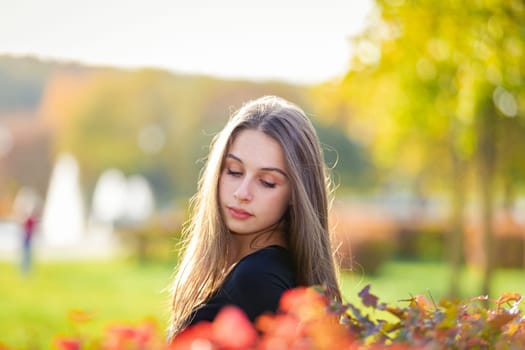 Portrait of a beautiful girl in an autumn park