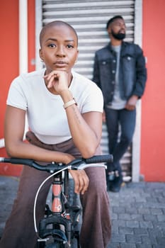 Bicycle, portrait and couple of friends for city travel, streetwear fashion and urban gen z lifestyle. Face of a confident black woman or cool people with a bike in urban sidewalk for youth cycling.