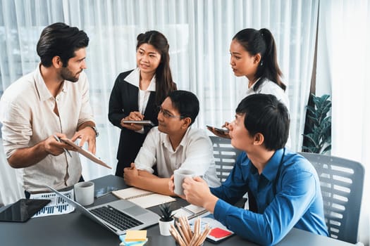 Group of diverse office worker employee working together on strategic business marketing planning in corporate office room. Positive teamwork in business workplace concept. Prudent