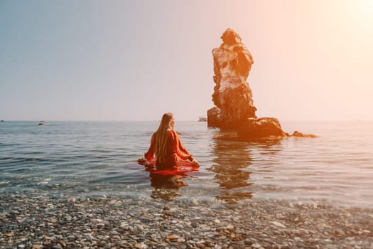 Woman travel sea. Happy tourist taking picture outdoors for memories. Woman traveler looks at the edge of the cliff on the sea bay of mountains, sharing travel adventure journey.