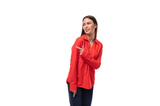 young caucasian model woman with straight black hair dressed in a red blouse on a white background.