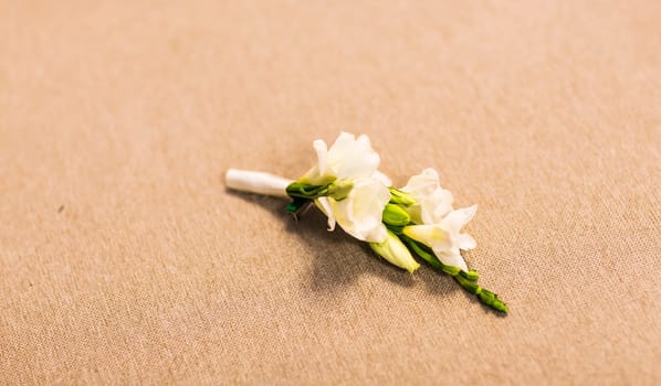 Gentle groom's boutonniere. Wedding accessories for a groom