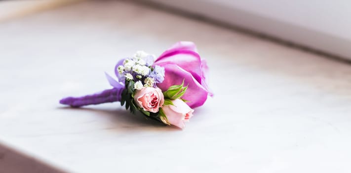 Gentle groom's boutonniere. Wedding accessories for a groom