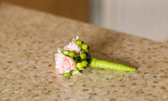 Gentle groom's boutonniere. Wedding accessories for a groom