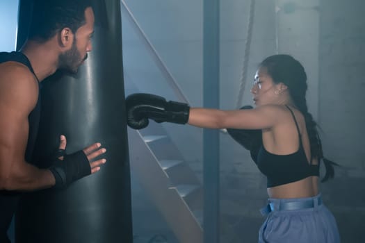 Fit and Strong Multicultural Couple Practicing Boxing Together in the Gym, Promoting Health and Unit. Real people sport concept. High quality photo