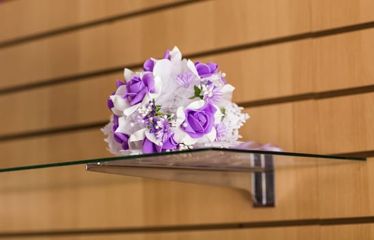 Beautiful purple artificial wedding bridal flowers bouquet.