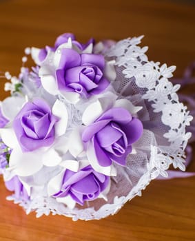 Beautiful purple artificial wedding bridal flowers bouquet.