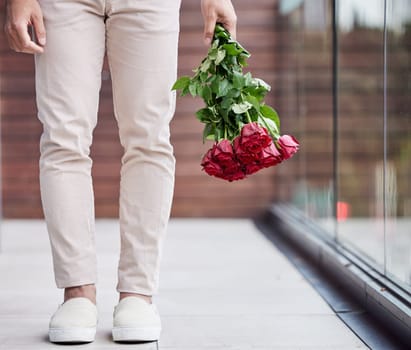 Love, legs and man with bouquet of flowers for date, romance and hope for valentines day. Romantic confession, floral gift and person holding red roses, standing outside for proposal or engagement