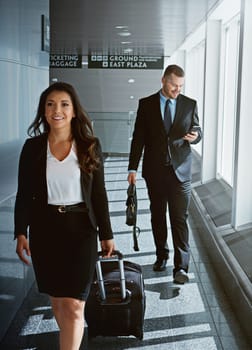 Walking, portrait or business woman in airport with suitcase, luggage or baggage for a global trip. People, happy or corporate workers in lobby for holiday travel or journey on international flight.