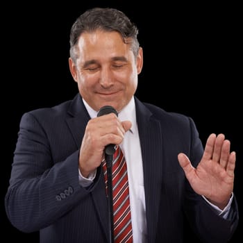 Microphone, speaker and business man on black background for presentation, speech and seminar. Professional, public speaking and worker talking for conference, tradeshow and communication in studio.