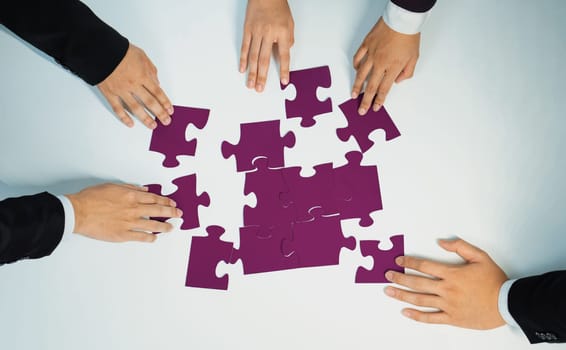 Top view panorama banner of business team assembling jigsaw puzzle over table symbolize business partnership and collective teamwork for HR recruitment and job seeker background. Shrewd