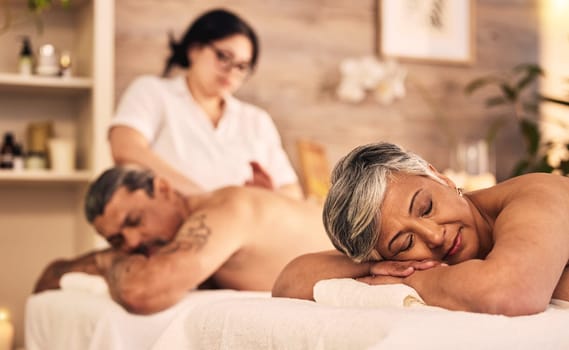Relax, senior and a couple at the massage salon together for peace, wellness or bonding. Luxury, beauty or body care with an old woman and man in a spa for physical therapy or treatment at a resort.