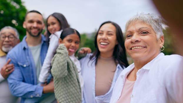 Park selfie of big family, happy kids and parents, smile and bonding on weekend in nature. Photography, fun and memory for grandparents, mother and father with children in garden portrait with love