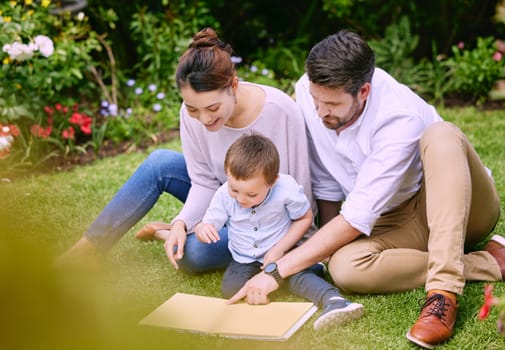 Family is the most important thing in the world. a family reading a book outside