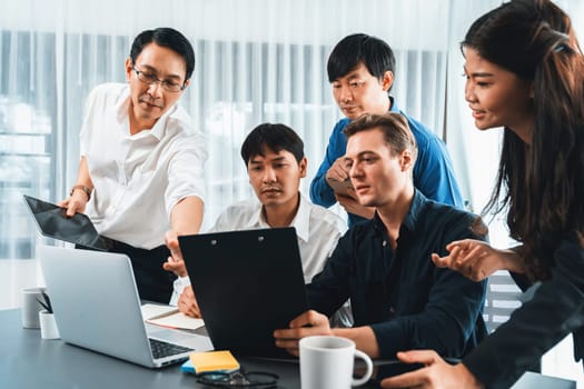 Group of diverse office worker employee working together on strategic business marketing planning in corporate office room. Positive teamwork in business workplace concept. Prudent