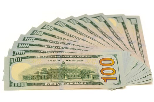 100 dollar bills on white background fanned out 10